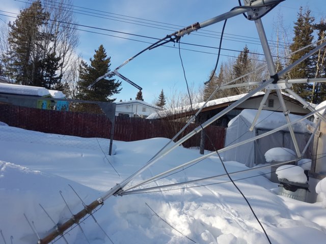 installingjpoleantennaattopof30tower2.jpg
