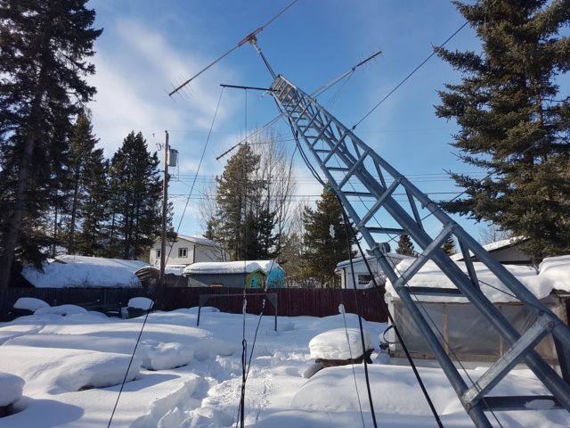installingjpoleantennaattopof30tower3.jpg
